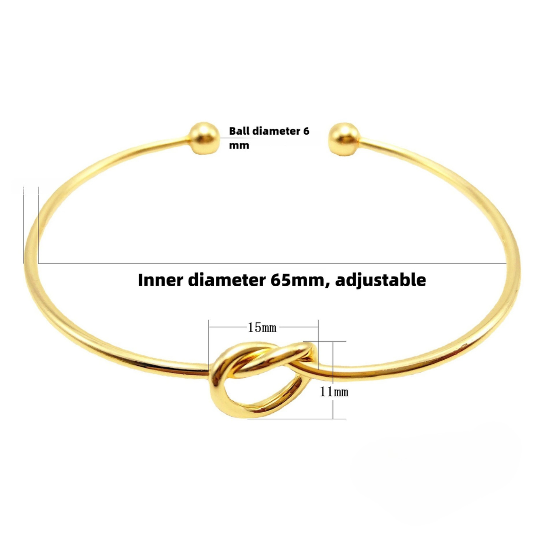 Bracelet doré avec détail nœud